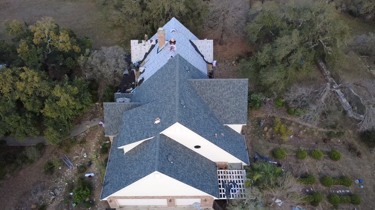 Acacia Roofing team completing a roof installation in Austin Texas